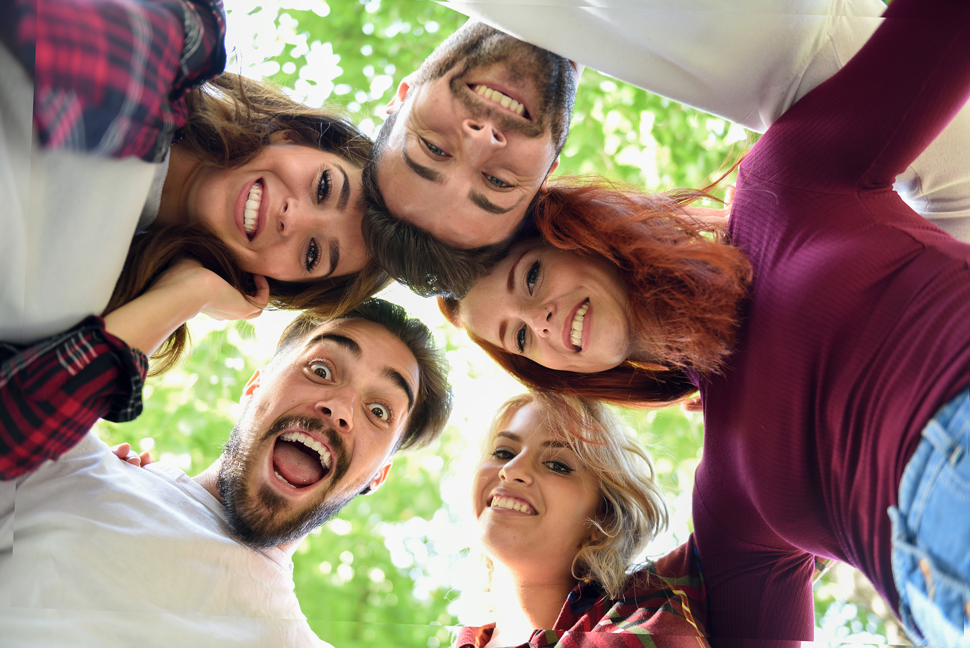 friends-in-circle-with-heads-together-smiling