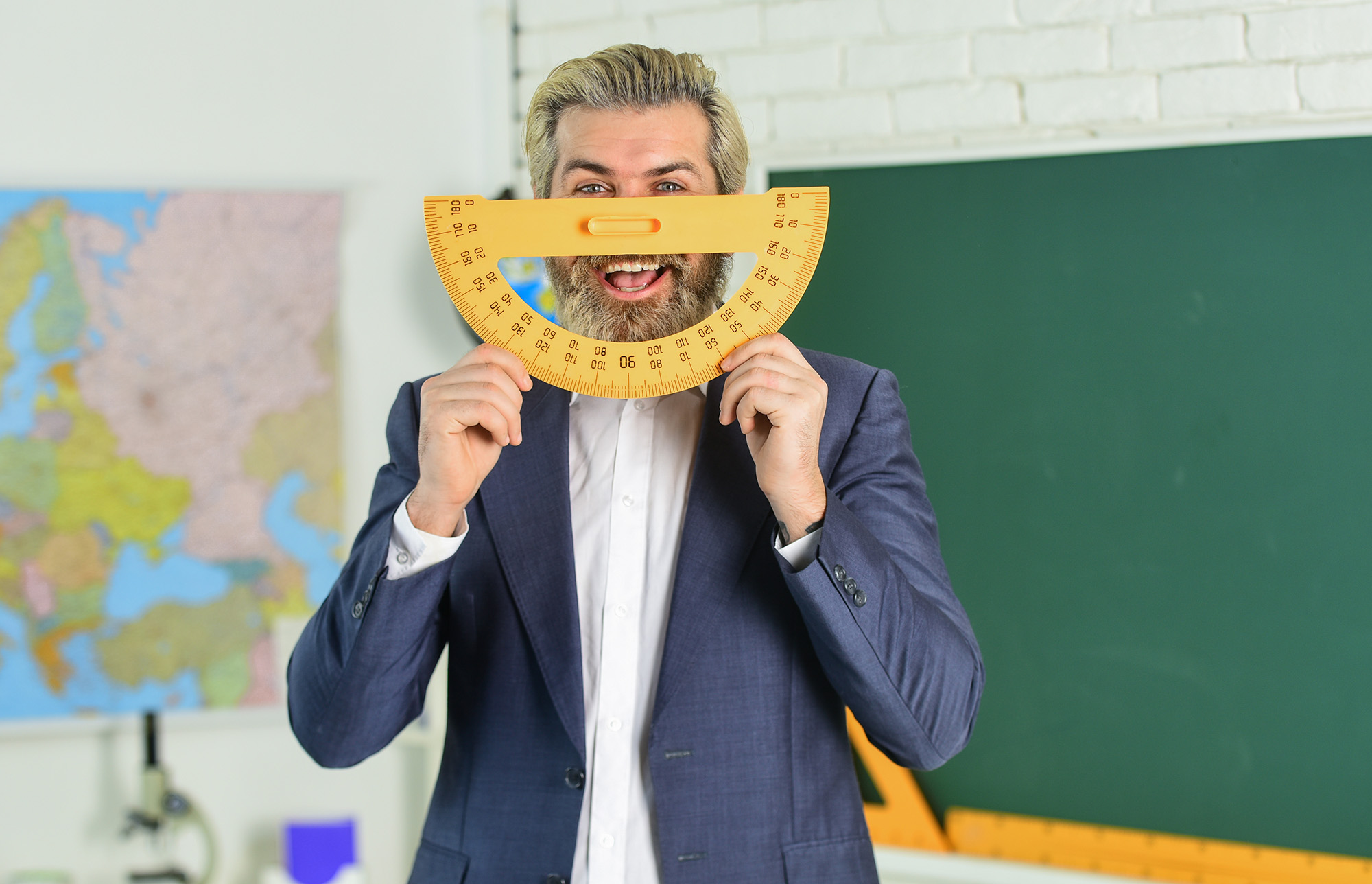 handsome-bearded-man-in-classroom-chalkboard-study-and-education-modern-school-knowledge-day-modern-teaching-method-each-school-defines-final-examination-sessions-modern-teacher-lesson