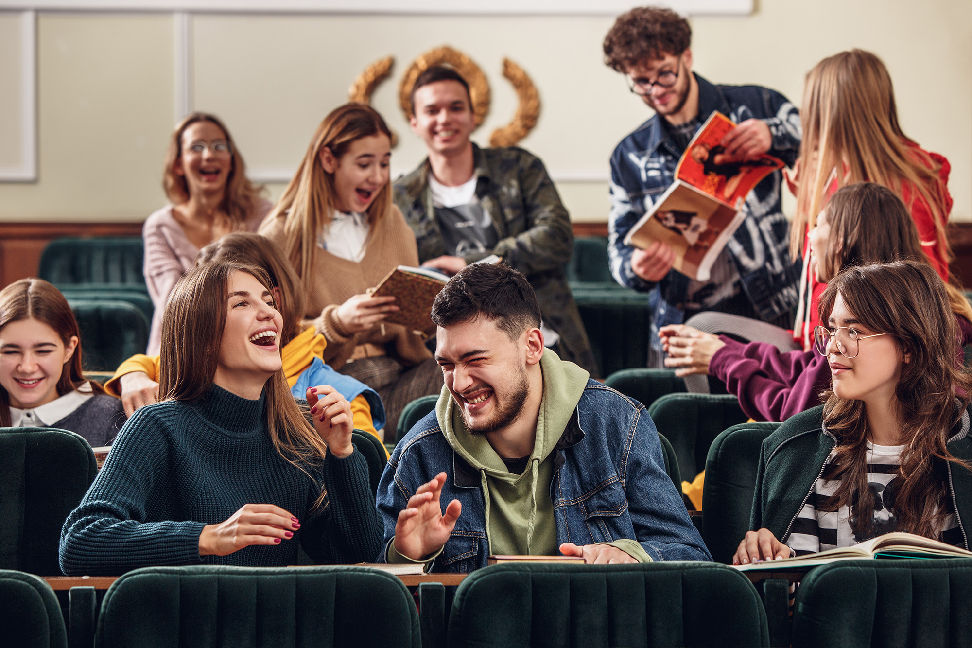 the-group-of-cheerful-happy-students-sitting-in-a-lecture-hall-before-lesson